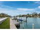 Scenic waterfront view with a private boat dock and clear blue skies at 3550 Flamingo Ave, Sarasota, FL 34242