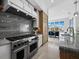 Contemporary kitchen featuring stainless steel appliances and marble countertops at 3550 Flamingo Ave, Sarasota, FL 34242