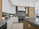Contemporary kitchen design showcasing stainless steel appliances, marble countertops, and custom cabinetry at 3550 Flamingo Ave, Sarasota, FL 34242