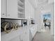 Elegant butler's pantry features white cabinets, quartz countertop, and modern fixtures at 3550 Flamingo Ave, Sarasota, FL 34242