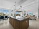 Spacious kitchen island with breakfast bar, stainless steel appliances, and a seamless living area at 3550 Flamingo Ave, Sarasota, FL 34242