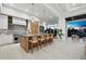 Modern kitchen features an island with bar stool seating and stainless steel appliances at 3550 Flamingo Ave, Sarasota, FL 34242