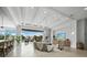 Spacious living room with modern lighting, comfortable seating, and expansive outdoor views at 3550 Flamingo Ave, Sarasota, FL 34242