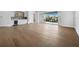 Open living area with hardwood flooring, wet bar and sliding glass doors leading to an outdoor area at 3550 Flamingo Ave, Sarasota, FL 34242