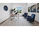 Bright home office with large window, modern desk, and comfortable seating, offering a serene workspace for productivity at 3550 Flamingo Ave, Sarasota, FL 34242