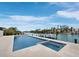 The sparkling pool with a spa overlooks the waterfront, creating a resort-like atmosphere with picturesque water views at 3550 Flamingo Ave, Sarasota, FL 34242