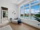 Serene sitting area with views of the canal, comfortable seating, and large windows that provide ample natural light at 3550 Flamingo Ave, Sarasota, FL 34242