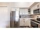 Modern kitchen with stainless steel appliances and white cabinets at 4138 Central Sarasota Pkwy # 1534, Sarasota, FL 34238