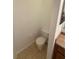 Bathroom featuring a white toilet, neutral walls, and a tiled floor at 14812 Skip Jack Loop, Lakewood Ranch, FL 34202