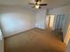 Neutral colored bedroom with carpeted floors, ceiling fan, and natural light at 14812 Skip Jack Loop, Lakewood Ranch, FL 34202