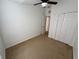 Spacious bedroom featuring neutral walls and carpeted flooring with a closet at 14812 Skip Jack Loop, Lakewood Ranch, FL 34202