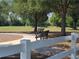 Park with benches and walking path under shady trees at 14812 Skip Jack Loop, Lakewood Ranch, FL 34202