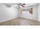 Bedroom with ceiling fan, window, and closet at 6038 Lilli Way # 6038, Bradenton, FL 34207