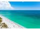 Aerial view of a beach with people and umbrellas at 6038 Lilli Way # 6038, Bradenton, FL 34207