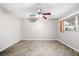 Bedroom with ceiling fan and window at 6038 Lilli Way # 6038, Bradenton, FL 34207