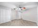 Bedroom with ceiling fan and double door closet at 6038 Lilli Way # 6038, Bradenton, FL 34207
