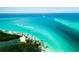 Breathtaking aerial view of a tranquil beach with boats and clear water at 6038 Lilli Way # 6038, Bradenton, FL 34207