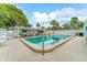 Inviting community pool with plenty of lounge chairs for relaxation at 6038 Lilli Way # 6038, Bradenton, FL 34207