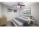 Comfortable bedroom with neutral decor and a ceiling fan at 6038 Lilli Way # 6038, Bradenton, FL 34207