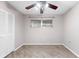 Well-lit bedroom with wood-look flooring and a closet at 6038 Lilli Way # 6038, Bradenton, FL 34207