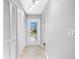 Inviting entryway with built-in storage and light wood flooring at 6038 Lilli Way # 6038, Bradenton, FL 34207