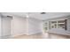 Large living room with an open floor plan and wood-look flooring at 6038 Lilli Way # 6038, Bradenton, FL 34207