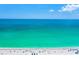 Beach with people swimming and relaxing under umbrellas at 6038 Lilli Way # 6038, Bradenton, FL 34207