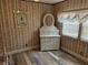 Bedroom with white wicker dresser, floral wallpaper and window blinds at 10 White Oak Ter, Sarasota, FL 34237