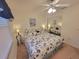 Bright bedroom featuring a king-size bed and mirrored closet at 6507 Stone River Rd # 302, Bradenton, FL 34203