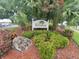 Landscaped entrance sign for The Terraces at 6507 Stone River Rd # 302, Bradenton, FL 34203