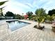 Inviting pool area with a spacious patio and lush landscaping at 2760 Chipley Ave, North Port, FL 34286