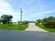Single-story home with a large front yard, driveway, and attached garage at 2760 Chipley Ave, North Port, FL 34286