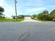 Single-Gathering home with a two car garage and tropical landscaping at 2760 Chipley Ave, North Port, FL 34286