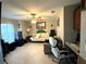 Home office with comfortable seating, a desk, and plenty of natural light at 2760 Chipley Ave, North Port, FL 34286