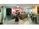 Open living room and kitchen with modern electric fireplace at 2760 Chipley Ave, North Port, FL 34286