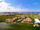 Aerial view of the community showcasing its waterfront location, lush landscaping, and resort-style amenities at 360 Gulf Of Mexico Dr # 322, Longboat Key, FL 34228
