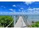 Wooden dock extending to the water at 360 Gulf Of Mexico Dr # 322, Longboat Key, FL 34228