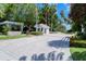 Gated entrance to the community with meticulously maintained landscaping and a secure entry point at 360 Gulf Of Mexico Dr # 322, Longboat Key, FL 34228