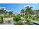 Beautiful landscaping surrounding the exterior of the home with ocean view at 360 Gulf Of Mexico Dr # 322, Longboat Key, FL 34228