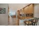 Gourmet kitchen featuring custom cabinets, granite counters, breakfast bar and stainless steel appliances at 360 Gulf Of Mexico Dr # 322, Longboat Key, FL 34228
