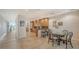 Open concept kitchen with wood cabinets and breakfast nook at 360 Gulf Of Mexico Dr # 322, Longboat Key, FL 34228