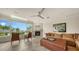 Comfortable living room featuring a fireplace, stylish furniture, and amazing ocean view through large windows at 360 Gulf Of Mexico Dr # 322, Longboat Key, FL 34228