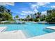 Inviting community pool with a gradual entry and plenty of space for relaxation and recreation at 360 Gulf Of Mexico Dr # 322, Longboat Key, FL 34228