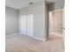 Bedroom with double door closet and access to bathroom at 16121 Old Fox Trl, Port Charlotte, FL 33953