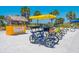 Beach bike rentals with palm trees and a sunny, picturesque view offer a perfect coastal experience at 324 Madeira Cir, Tierra Verde, FL 33715