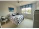 Cozy bedroom featuring nautical-themed décor, a comfortable bed, and a bright window at 324 Madeira Cir, Tierra Verde, FL 33715