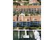 View of the condos at The Palms of Tierra with balconies and personal boat slips at 324 Madeira Cir, Tierra Verde, FL 33715