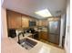Well-equipped kitchen with stainless steel appliances and granite countertops at 324 Madeira Cir, Tierra Verde, FL 33715