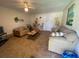 Spacious living room with tile flooring, ample seating, and a casual atmosphere at 324 Madeira Cir, Tierra Verde, FL 33715