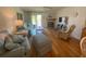 Cozy living room with wood floors, a fireplace, and lots of natural light at 324 Madeira Cir, Tierra Verde, FL 33715